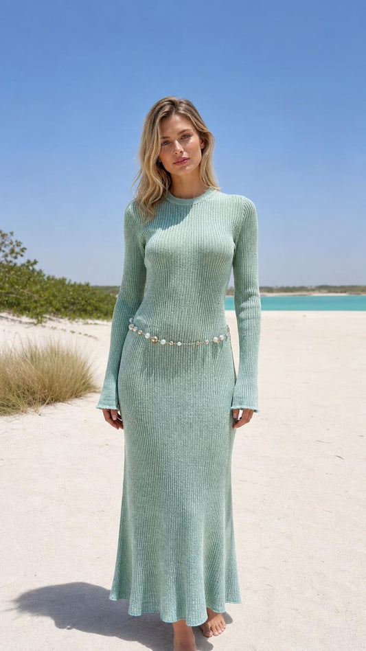 Front view of model wearing mint green ribbed knit maxi dress on beach