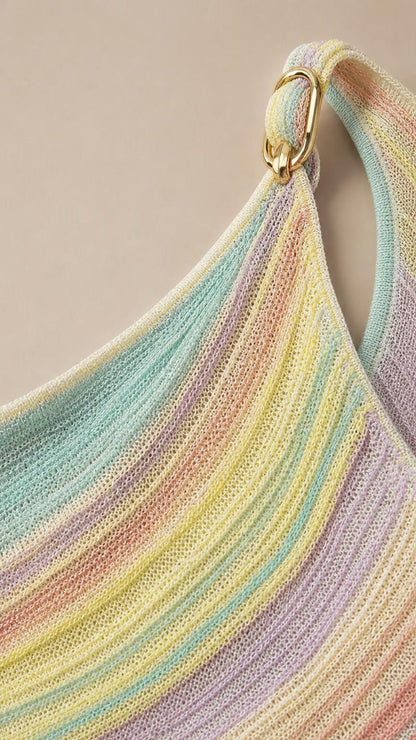 Close-up of shoulder strap with metal ring accent and knit texture